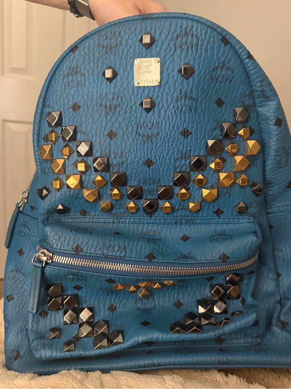 MCM Blue Studded Monogram Leather Backpack with Gold & Gunmetal Accents